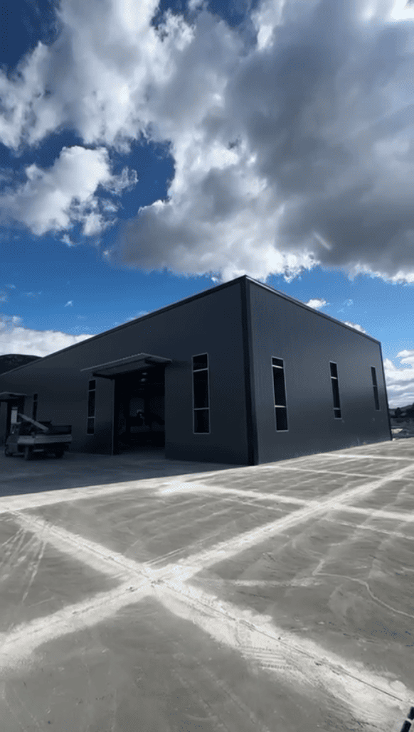 Steel-framed, insulated sandwich panel roof and enclosure system for padel courts in Germany.